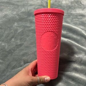 Pink studded Starbucks cup